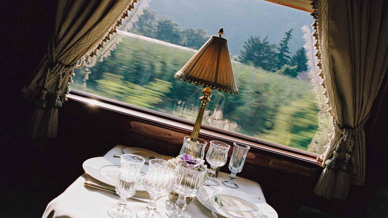 Art deco dining car of the Venice Simplon-Orient-Express set for dinner with Lalique glass panels