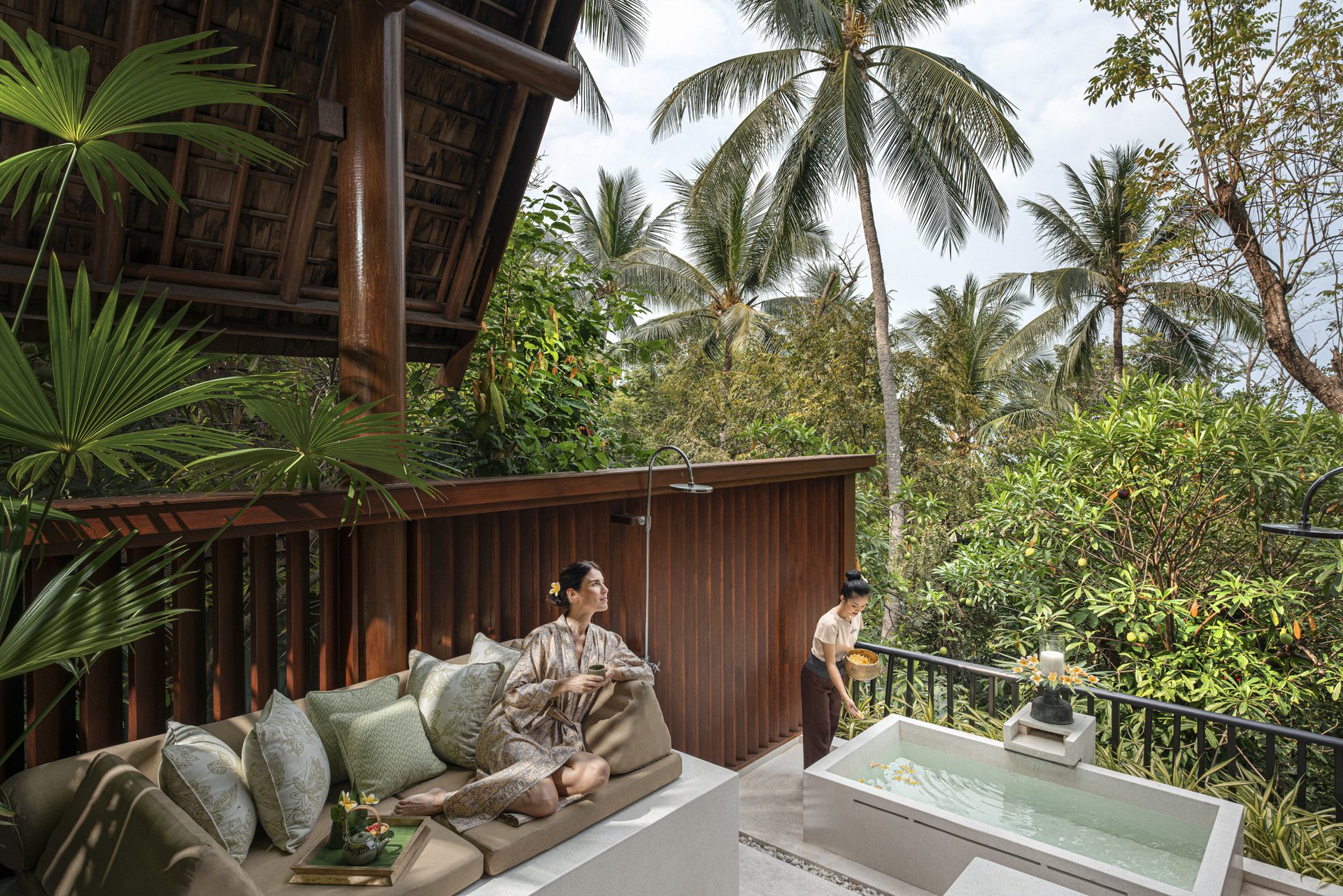 Open-air spa treatment pavilion overlooking jungle and sea at Four Seasons Resort Koh Samui