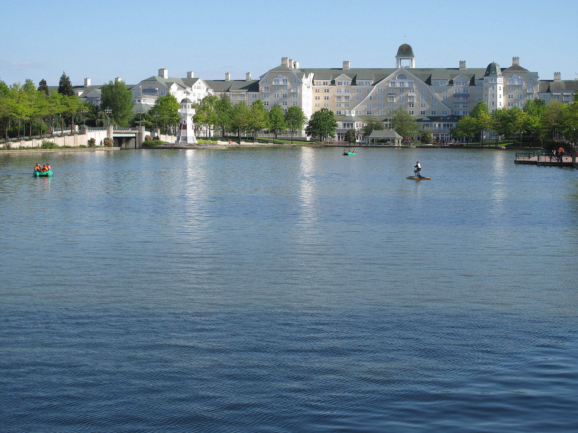 Lakeside resort hotel at Disneyland Paris seen across the water on a clear day