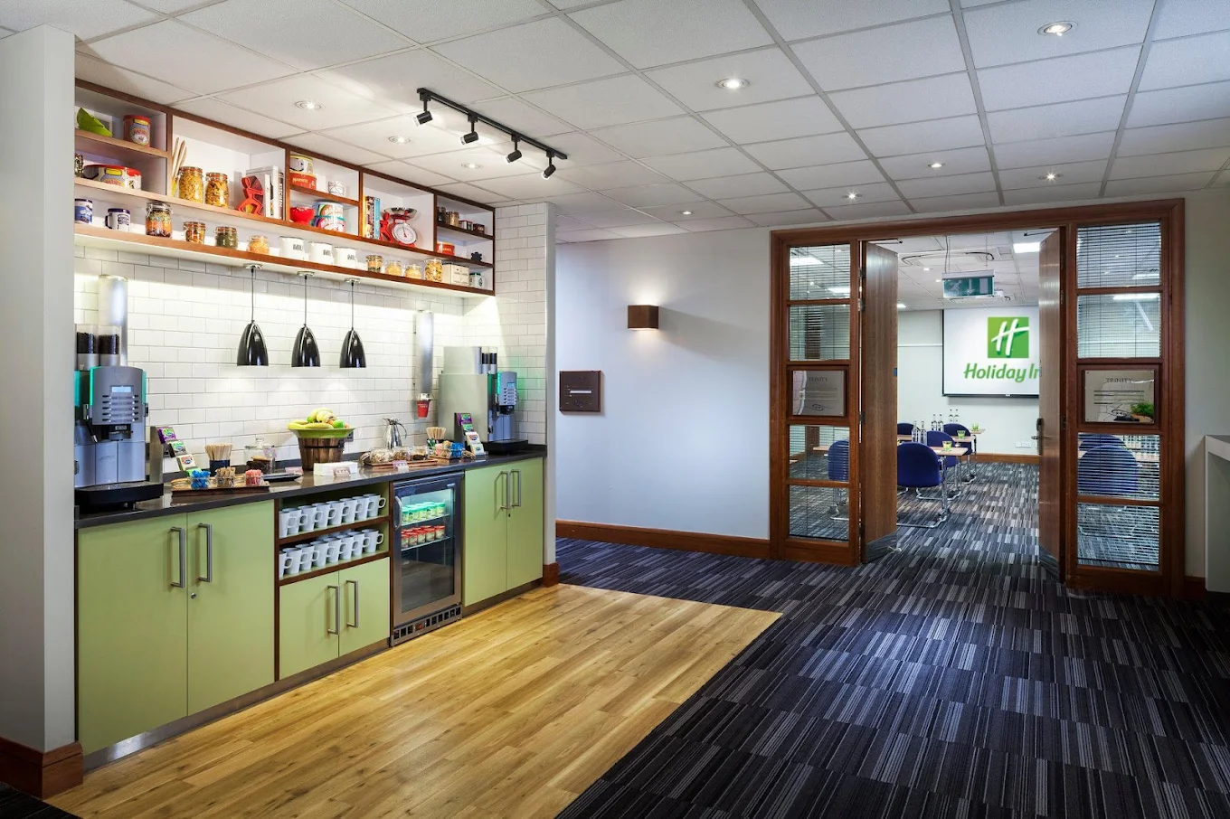 The Academy conference centre at Holiday Inn London Regent's Park with coffee station, refreshment area and glass doors opening into a fitted meeting room