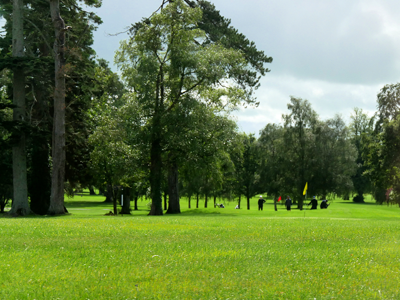 Clubhouse and landscaped grounds beside the golf course at Adare Manor