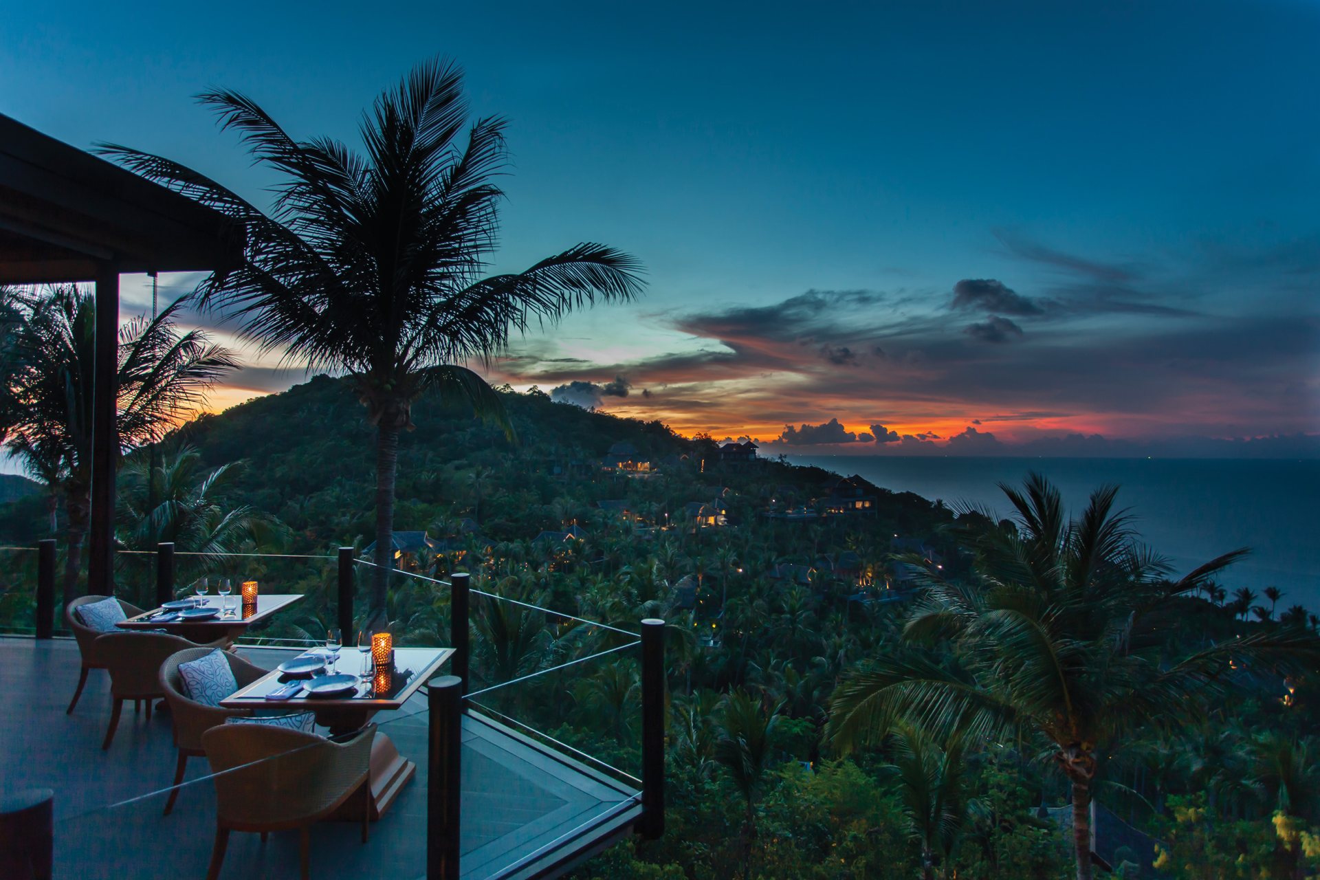 Sunset dinner table overlooking the bay at Four Seasons Resort Koh Samui