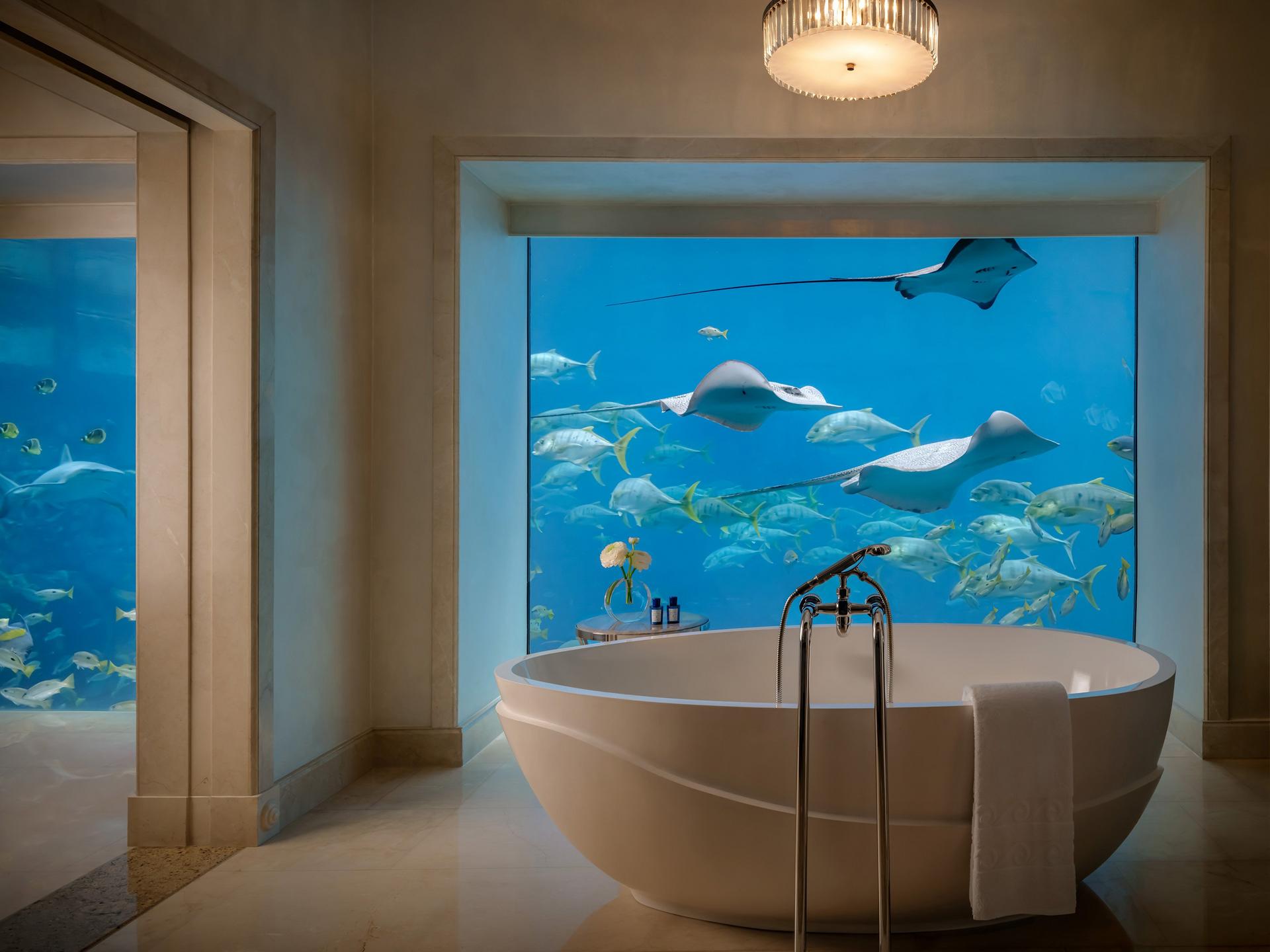 Underwater Suite at Atlantis The Palm Dubai with floor-to-ceiling windows into the Ambassador Lagoon aquarium