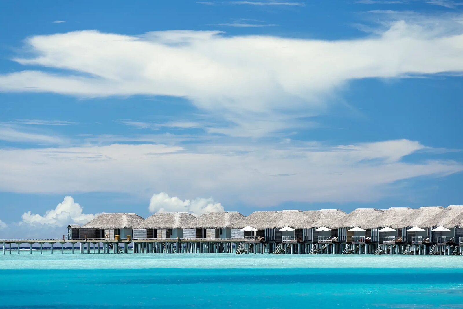 Water villas over the lagoon at Velassaru Maldives