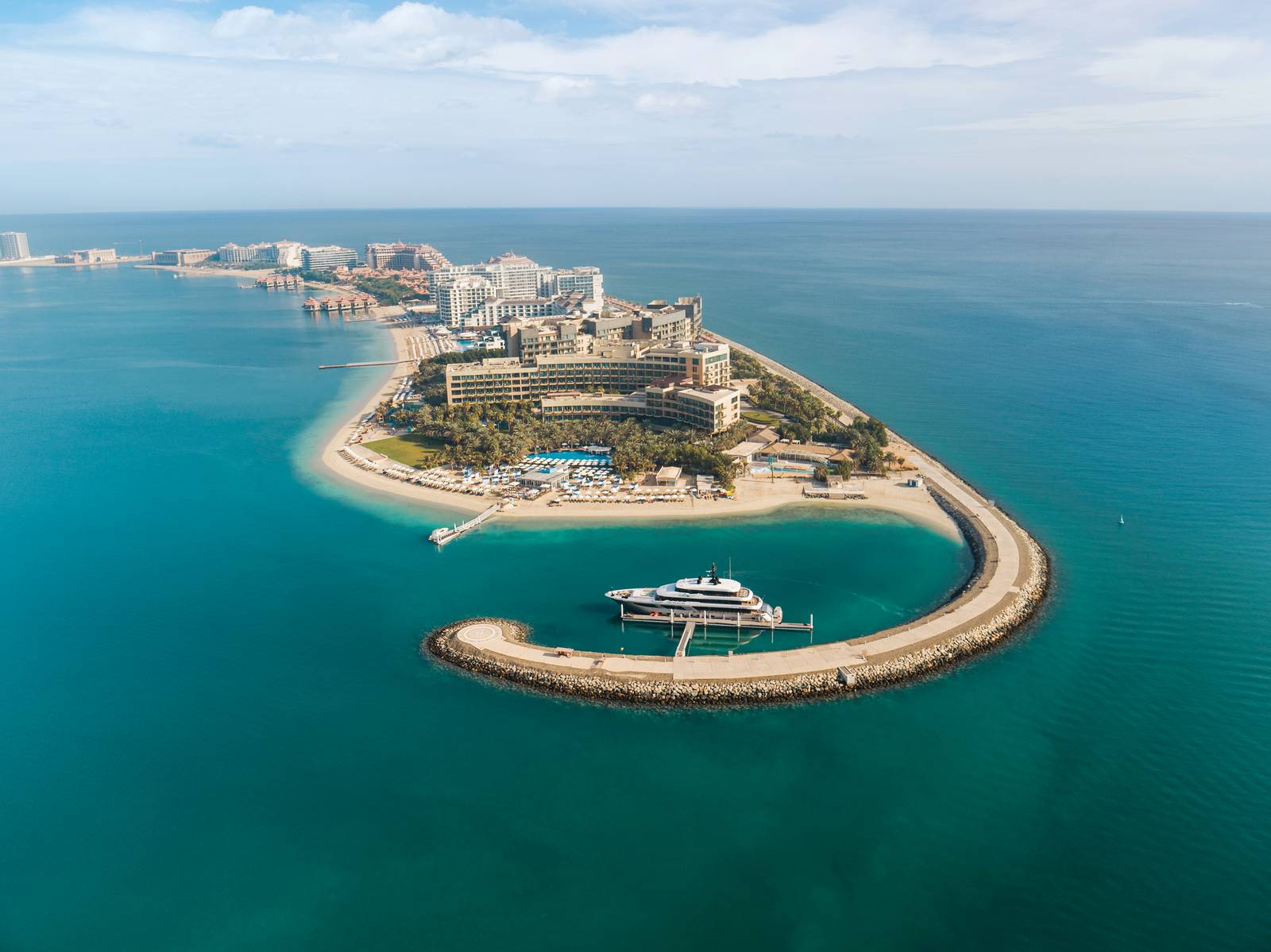 Rixos The Palm Dubai Hotel & Suites exterior and beachfront on Palm Jumeirah